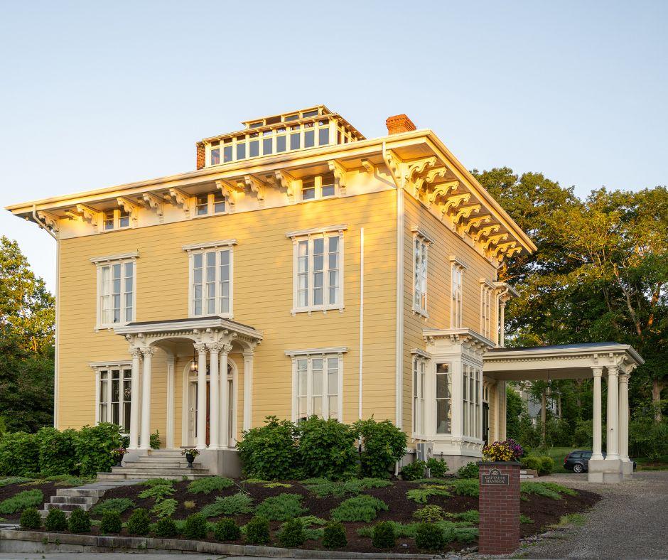 Front view of the Captain's Mansion, a large historic home with three floors